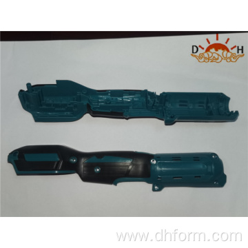 Two color plastic injection molded power tool handles